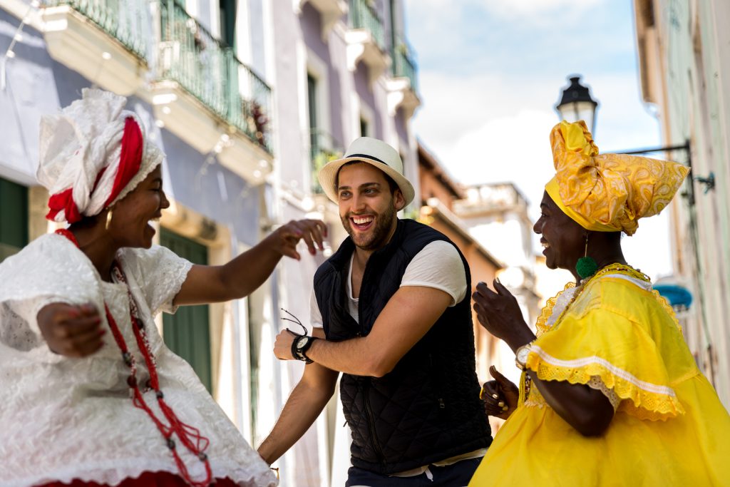 Tourist dancing with local "Baianas" at Festival.